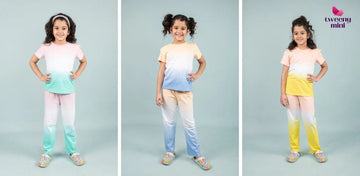 Girls modeling colorful tie-dye night suits with matching tops and pants for kids